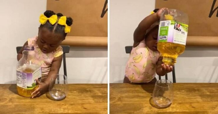 Bambina prova a versare da sola il succo